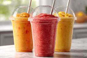 Three colorful, refreshing smoothie cups.