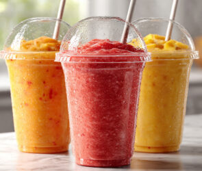 Three colorful, refreshing smoothie cups.